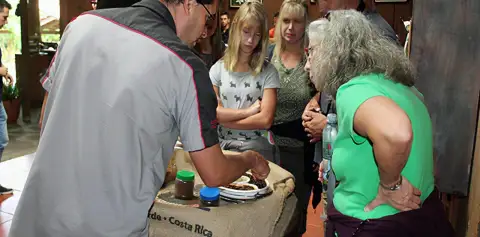 Junior giving a coffee tour in Monteverde