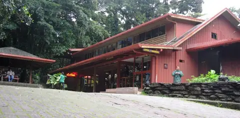 Red wooden visitor centre at the Monteverde Cloud Forest Reserve entrance